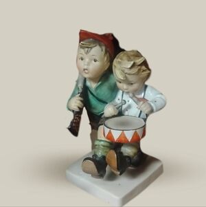 Charming Hummel Musical Figurine with Red and Green Accents